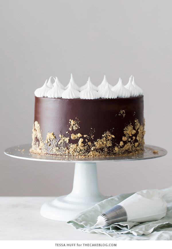 S'mores Cake - s'more inspired layer cake recipe with chocolate cake, graham cracker buttercream, chocolate ganache and toasted marshmallow meringue | by Tessa Huff for TheCakeBlog.com