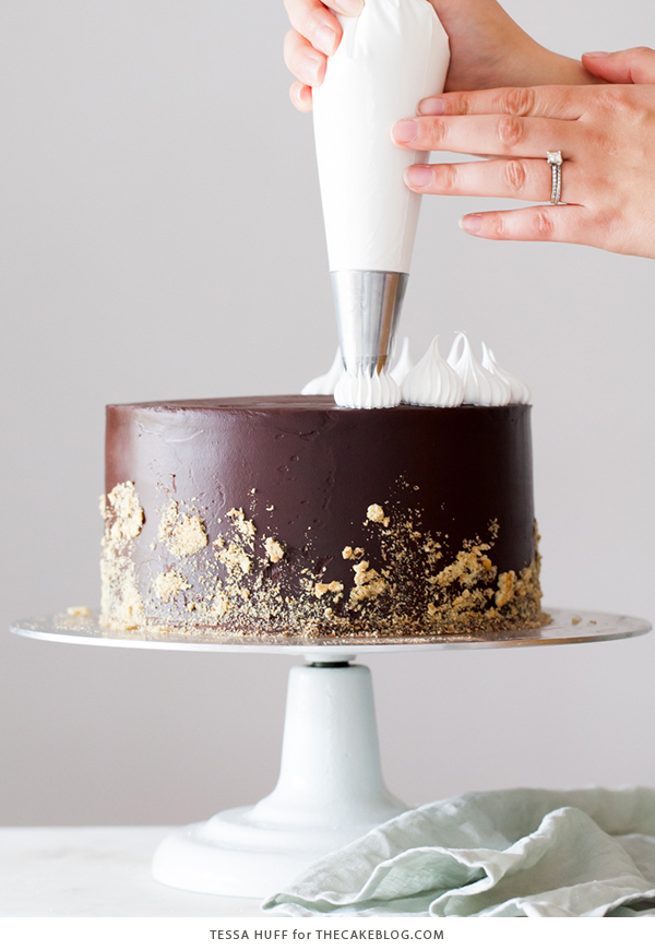 S'mores Cake - s'more inspired layer cake recipe with chocolate cake, graham cracker buttercream, chocolate ganache and toasted marshmallow meringue | by Tessa Huff for TheCakeBlog.com