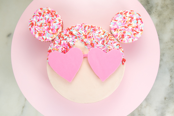 Sprinkle Girl Cake - how to make cute girly face cakes with sprinkles for the hair and chocolate heart sunglasses | by Erin Gardner for TheCakeBlog.com