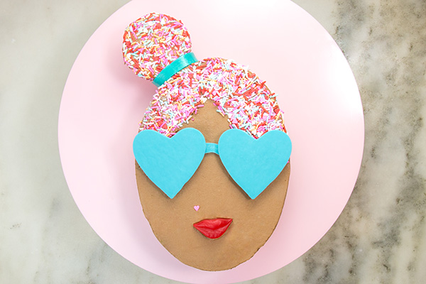 Sprinkle Girl Cake - how to make cute girly face cakes with sprinkles for the hair and chocolate heart sunglasses | by Erin Gardner for TheCakeBlog.com
