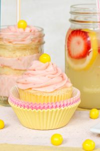 Strawberry Lemonade Cupcakes - moist lemon cupcakes paired with fresh strawberry buttercream for the perfect combination of sour and sweet | by Lauren Kapeluck for TheCakeBlog.com