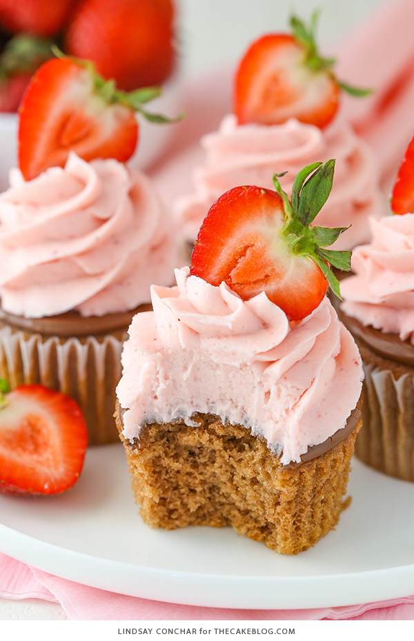 Strawberry Nutella Cupcakes with a soft, fluffy Nutella cupcake topped with more Nutella and a fresh strawberry frosting | by Lindsay Conchar for TheCakeBlog.com