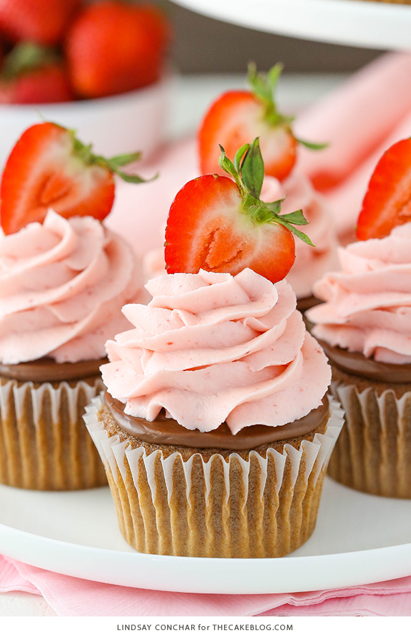 Strawberry Nutella Cupcakes with a soft, fluffy Nutella cupcake topped with more Nutella and a fresh strawberry frosting | by Lindsay Conchar for TheCakeBlog.com
