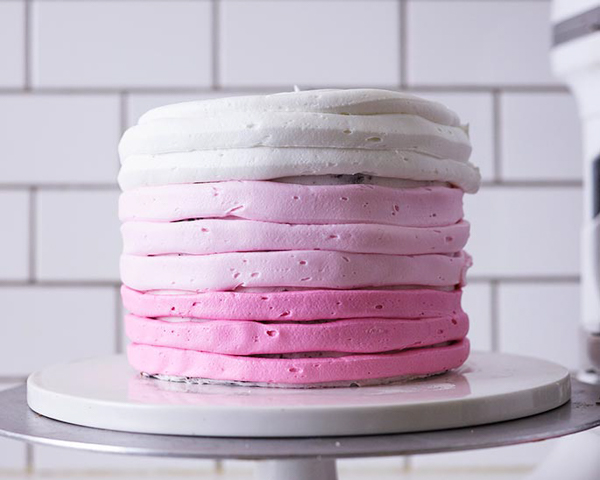 XOXO Valentine's Day Cake - how to make a pink ombre striped cake decorated with chocolate lips, hearts and an XOXO topper | by Cakegirls for TheCakeBlog.com