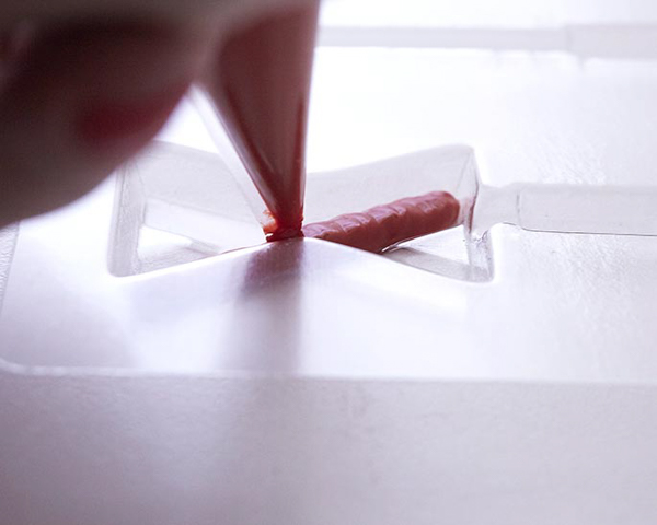 XOXO Valentine's Day Cake - how to make a pink ombre striped cake decorated with chocolate lips, hearts and an XOXO topper | by Cakegirls for TheCakeBlog.com